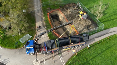 Graf UK tank being craned into a hole